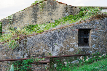Old countryside buildings. Worn and weathered mountain stone houses.