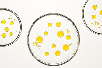 Yellow oil drops in water abstract background