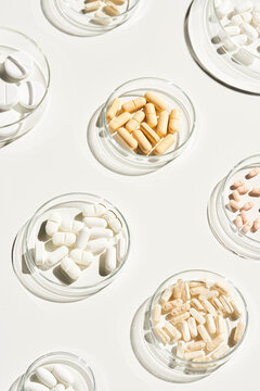 Collection of pills in bowls on table