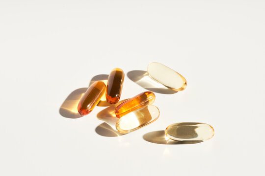 Various supplement capsules on table