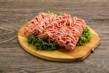 Raw pork minced meat over board