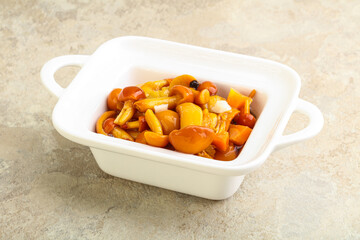 Marinated pickled honey mushrooms in the bowl