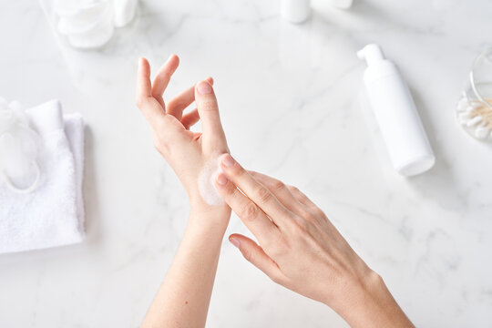 Woman rubbing foamy soap.