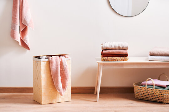 Pink towel in basket.