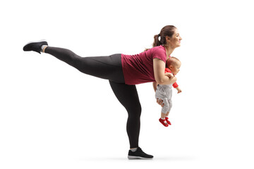 Woman exercising with a baby in her hands