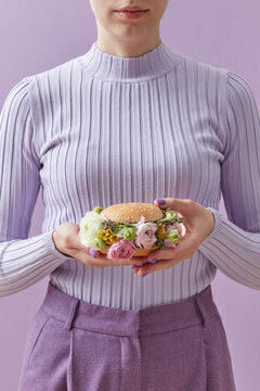 Woman with burger with peonies