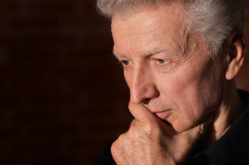 Close up portrait of thoughtful senior man