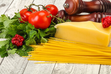 Raw Italian spaghetti heap with cheese