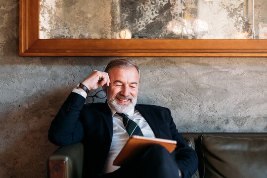 Senior Businessman Using Digital Tablet 