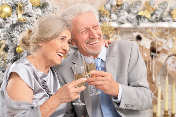 old couple with Christmas present