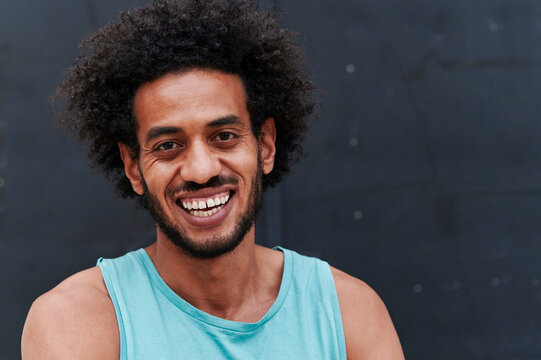 Fit young man smiling after a run