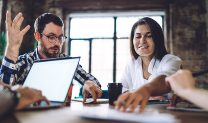 Group of millennial remote colleagues discussing mockup technology with copy space area for...