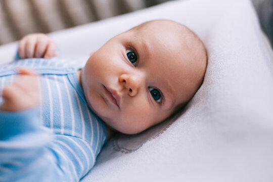 Baby portrait in blue onesie 