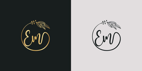 luxury golden signature letter E and m isolated circle with leaves ahead. vector monogram for cosmetic, restaurant, boutique, hotel , nature logo concept vector - obrazy, fototapety, plakaty