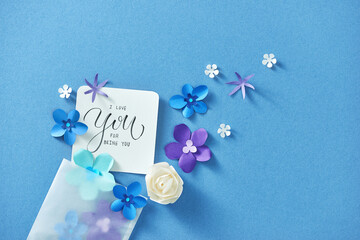 Love letter with flowers on blue