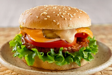 Hamburger on a plate. Fast food. Close-up. Poster. High quality photo