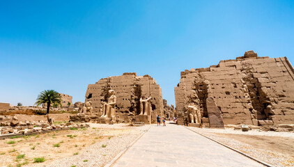 antique in the Karnak temple and tourists in luxury