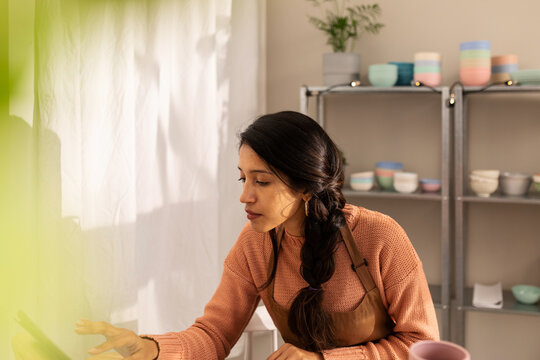 Indian woman working at online shop