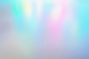 blur, grain, and texture of iridescent holographic abstract aurora light neon colors background. blurred pastel multicolored backdrop from glowing lights
