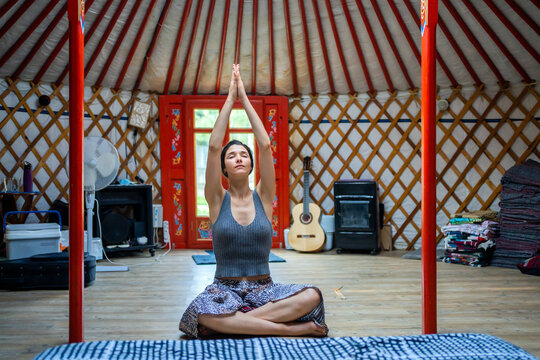 Woman Doing Meditation In A Yurt. 