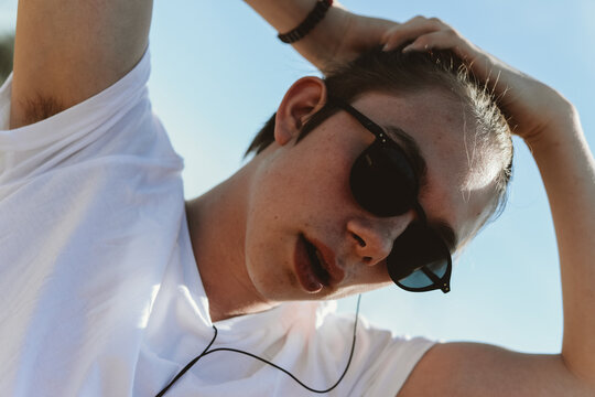  Young man Tying His Hair Up