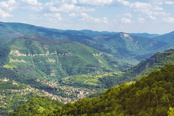 Beautiful Summer Mountain Landscape with Green Hills and Cloudy Sky .Bov Village in  Balkan Mountain ,Bulgaria 