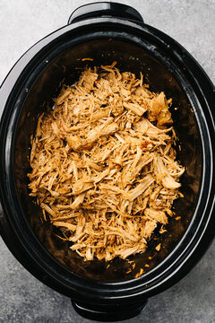 Shredded pulled pork in a crockpot