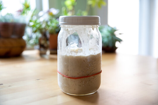 Jar of Sourdough Starter on a Kitchen Table