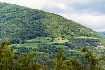 Beautiful Summer Mountain Landscape with Green Hills and Cloudy Sky .Bov Village in  Balkan Mountain ,Bulgaria 