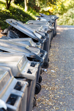 Row of Trash Can Lids