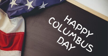 Fototapeta na wymiar Happy columbus day text on wooden slate and american flag on white background