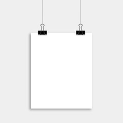 Realistic hanging blank paper sheet with shadow in A4 format with black paper clip.