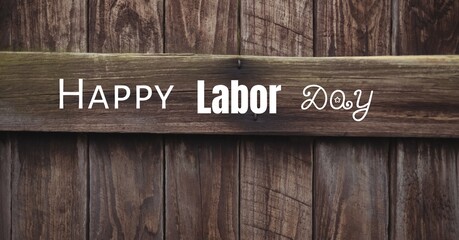 Happy labor day text against wooden plank background