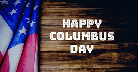 Happy columbus day text against american flag on wooden background