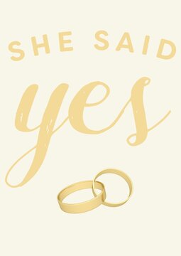 Composition of she said yes text with two gold wedding bands on yellow background