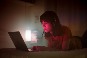 Bored young woman navigating through social media