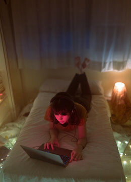 Bored woman listening music and navigating the internet