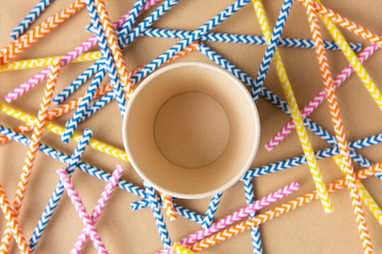 Recyclable Cardboard Cup Viewed From Above And Colored Paper Straws Around