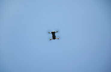 Flying drone under the sky.