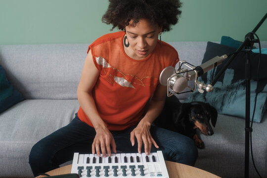 Female Musician Playing Keyboards And Singing