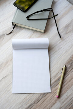 Pad of paper on wooden table