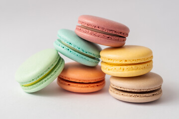 colorful macarons on white background