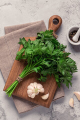 cutting board, parsley on a concrete table