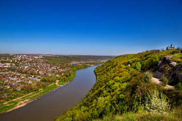 Fototapeta na wymiar Beautiful view of the canyon with the river Dniester and the city in summer. Zalischyky