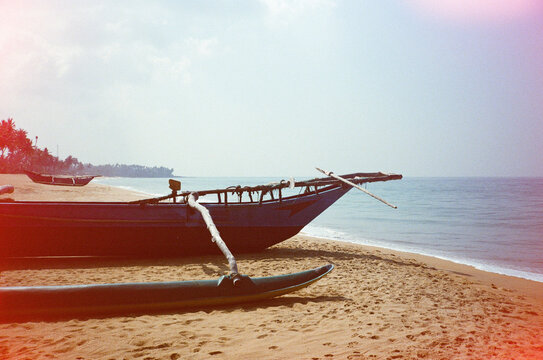 Traditional fishing boat on beach in Sri Lanka