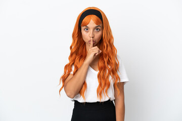 Young woman with orange hair isolated on white background showing a sign of silence gesture putting...