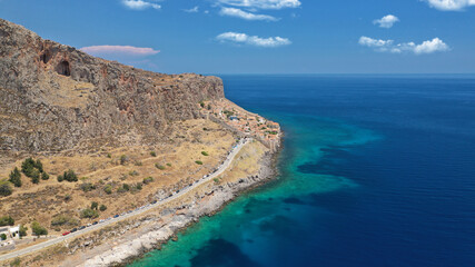 Fototapeta premium Aerial drone photo of beautiful castle and medieval old city of Monemvasia in the heart of Lakonia with beautiful clouds and deep blue sky, Peloponnese, Greece