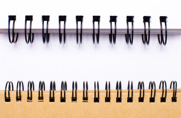 Space to insert text on white paper between two spiral notebooks. Template.