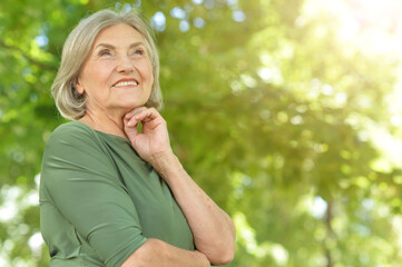 Fototapeta premium happy senior beautiful woman in spring park