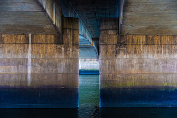 View of the concrete columns from under a bridge